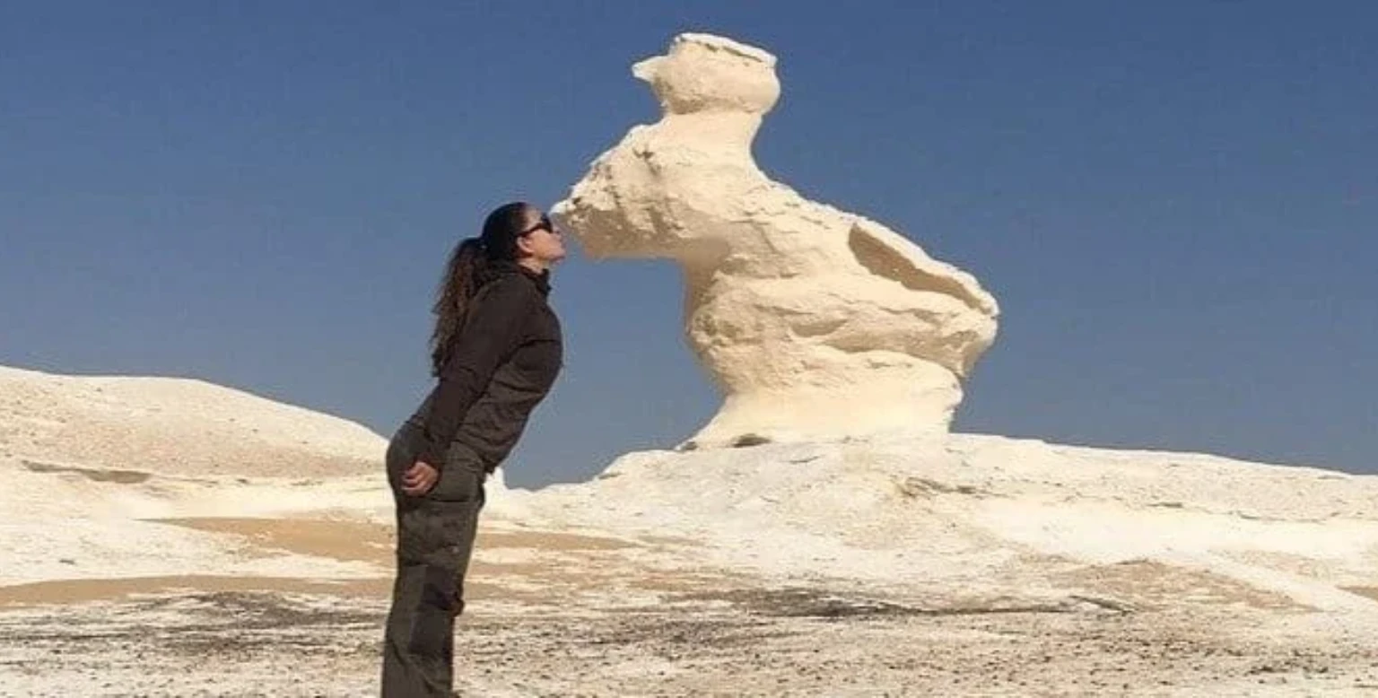 Archaeologists and tourists exploring ancient ruins in Egypt’s desert