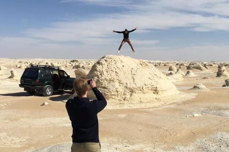 Glamping tents in Egypt’s White and Black Deserts under a starry night sky.