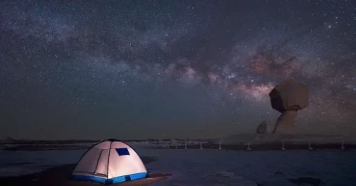 Travelers enjoying stargazing under the Milky Way in Egypt’s Western Desert.